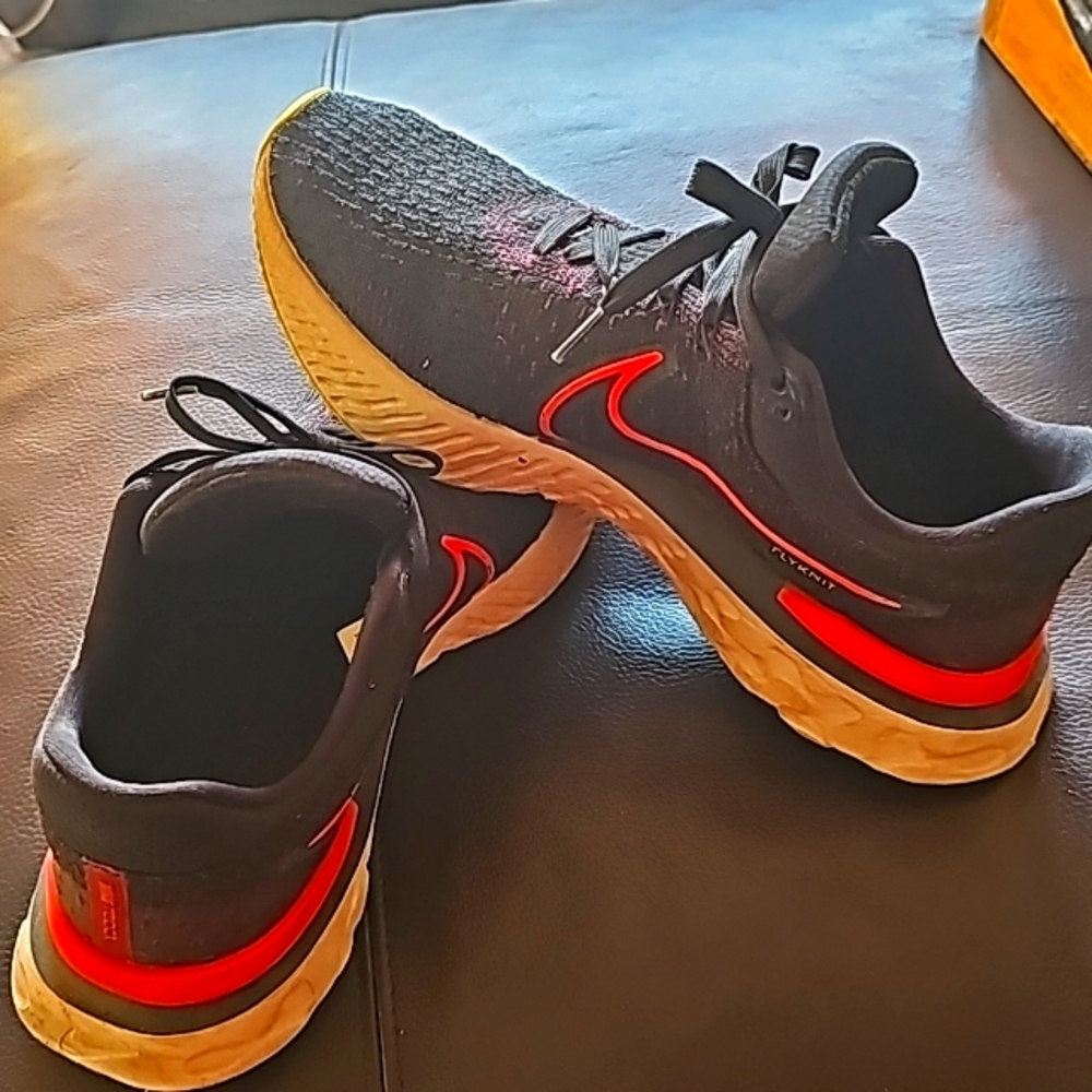 Nike React Flyknit athletic shoe size 11 USA.